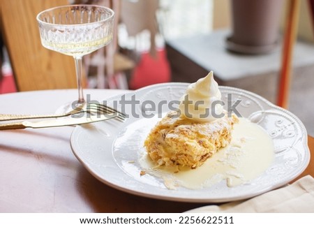 Napoleon Cake of puff pastry, traditional French dessert in cafe