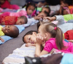 Nap-time. Preschool Children All Lying Down And Getting Ready For Bed.