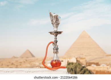 narguileh shisha water pipes in cairo egypt. Hookah on the background of the great pyramid complex on the Giza plateau. Cairo Egypt. Beautiful view of ancient Egyptian sights