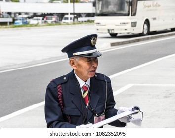 NARITA JAPAN APRIL 14 2018 , Japanese Narita Airport Staff Communicating With Tourist Bus Schedule At Narita Airport On APRIL 14 2018