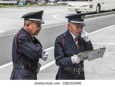 NARITA JAPAN APRIL 14 2018 , Japanese Narita Airport Staff Communicating For Tourist Bus Schedule At Narita Airport On APRIL 14 2018