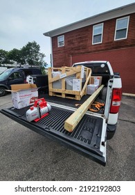 Narraganset, Rhode Island, USA Walk In Freezer Refrigeration Condensing Unit And Evaporator In Shipping Container Being Dropped Off At Location. Mechanical Contractor Installation.