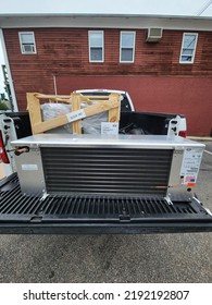 Narraganset, Rhode Island, USA Walk In Freezer Refrigeration Condensing Unit And Evaporator In Shipping Container Being Dropped Off At Location. Mechanical Contractor Installation.