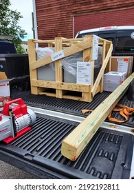 Narraganset, Rhode Island, USA Walk In Freezer Refrigeration Condensing Unit And Evaporator In Shipping Container Being Dropped Off At Location. Mechanical Contractor Installation.