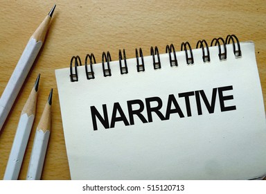 Narrative Text Written On A Notebook With Pencils