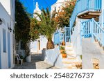 Narrow alley with typical traditional Greek houses on street of Chora village, Folegandros island, Cyclades, Greece