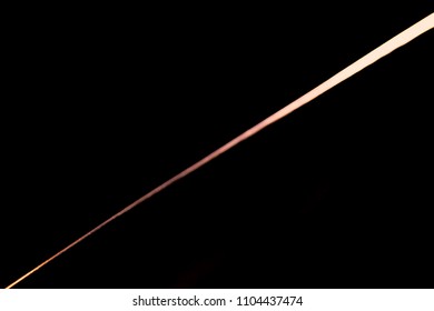 Narrow Beam Of Light On The Blade Of A Steel Knife On A Black Abstract Ray Background