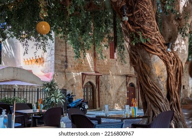 Narrow Cobbled Historical Streets Of Rhodes. Tourists Walk On Old Town, Rhodes, Dodecanese, Greece.