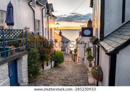 Narrow cobbled streets lined with cottages on a steep hill at Clovelly on the Devon coast