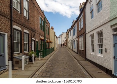 The Narrow Cobbled Streets In The Traditional Fishing Village. Whitby, North Yorkshire, England, UK