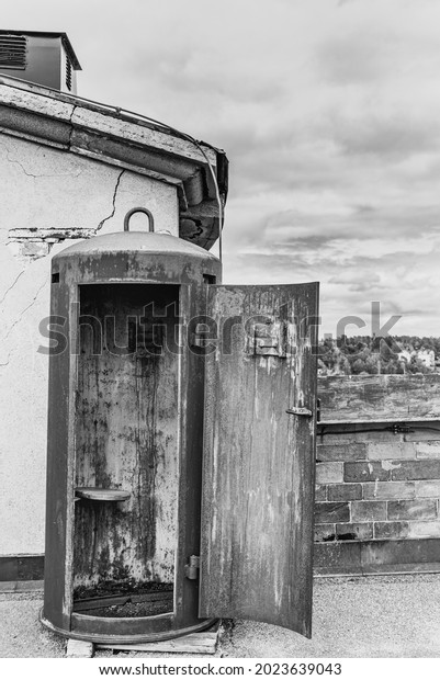 Narrow historical sentry box in an old fortress\
shows how sentry soldiers found shelter at war times. An old, rusty\
bartizan has not been used in ages in an old Swedish castle -\
Vaxholm Island, Sweden
