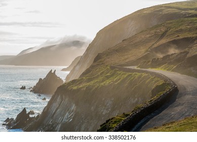 Narrow Irish Coastal Road In Spring Evening, Just Above The Steep And Dangerous Cliffs.