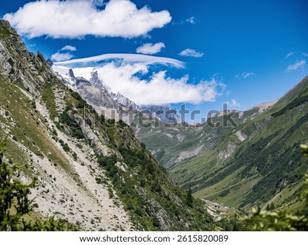 Narrow mountain path through steep rocky slopes