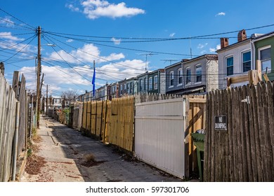 A Narrow Old Road Between Rows Of Homes In The Historic Northern Baltimore Neighborhood Of Hampden.