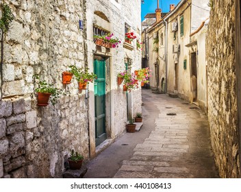 Narrow old street and yard in Sibenik city, Croatia, medieval zone - Powered by Shutterstock