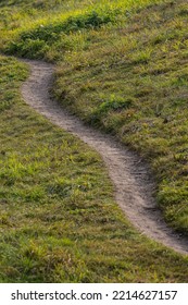 Narrow Path Down A Grass Slope.