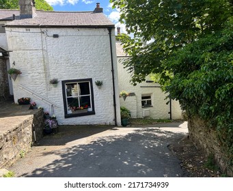 Narrow road, near Castle Hill, in the Yorkshire Dales market town of, Settle, UK - Shutterstock ID 2171734939