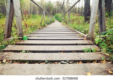 Narrow Rope Pedestrian Bridge Over Water. River