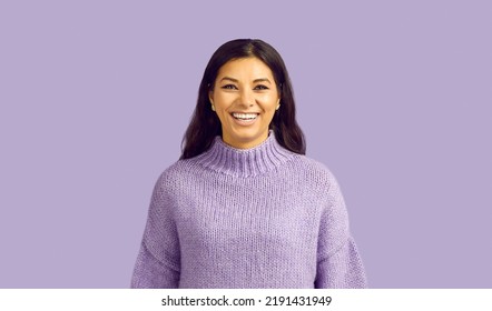 Narrow Shot Profile Picture Of Overjoyed Millennial Latino Girl In Sweater Isolated On Purple Studio Background. Headshot Of Excited Latin Young Woman Laugh Show Healthy White Teeth.