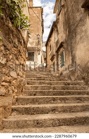 Narrow steep concrete stairs walkway leading uphill in Moscenicka Draga. Croatia.