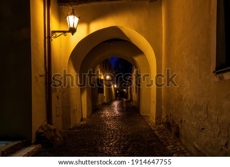 Narrow street with archway in medieval town Spisska Sobota at the night. Poprad city, Slovakia. Popular travel destination