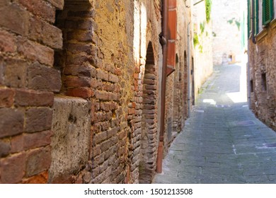 Narrow street footpath in Tuscany Montepulciano