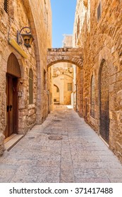 Narrow street and typical stoned houses of jewish quarter in Old City of Jerusalem, Israel.