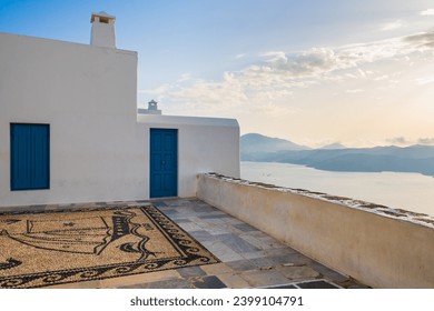 Narrow streets of Plaka village with traditional white houses at sunset time, Milos island, Cyclades, Greece - Powered by Shutterstock