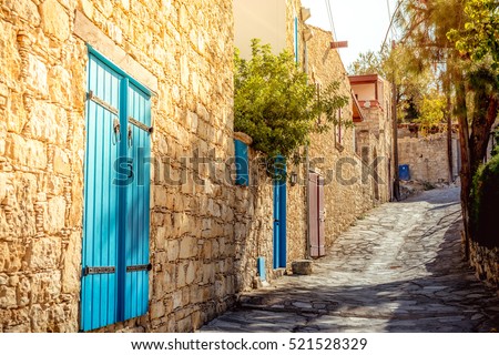 Narrow uphill cobbled street at Lofou village. Limassol District, Cyprus.