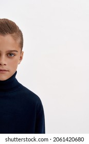 Narrow Vertical Image Portrait Of Little Teen Boy Child Half Face On White Studio Background. Small Teenage Kid As Younger Male Generation Pose Look At Camera. Childhood, Upbringing Concept.