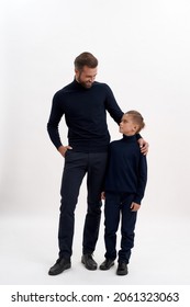 Narrow Vertical Shot Of Happy Young Caucasian Man Dad And Small Teen Son On White Studio Background Hug Show Family Unity Bonding. Smiling Father And Little Teenage Boy Child. Two Male Generations.