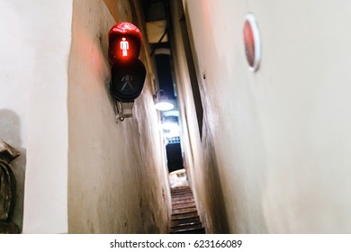 Narrowest street with traffic light in Prague city at night