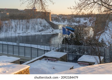 Narva Estonia. December 5, 2021 View of the waving flag of Estonia and Europe, on the border between Estonia and Russia