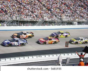 Nascar Race Cars On The Track At Dover