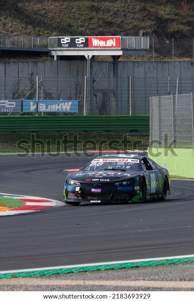 Nascar racing car\
challenging at track turn. Vallelunga, Italy, october 29 2021.\
American festival of\
Rome