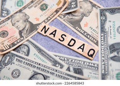 Nasdaq inscription next to US dollars. The Nasdaq is an American stock market index