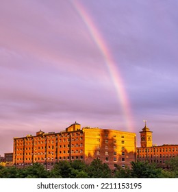 Nashua, New Hampshire, USA. 25-09-2021. Rainbow Over Historic Cotton Mill Buildings In An Old Industrial Park On The Nashua River