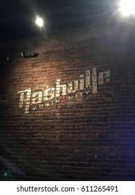 Nashville Music City sign on a brick wall background in Tennessee