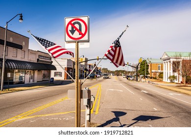 Nashville, North Carolina USA-02 17 2021: American Flags Fly At The Entrance To The Nashville Downtown District.