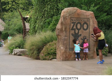 Nashville, Tennessee; August 24 2019; a mother taking picture of her kids in front of Nashville Zoo