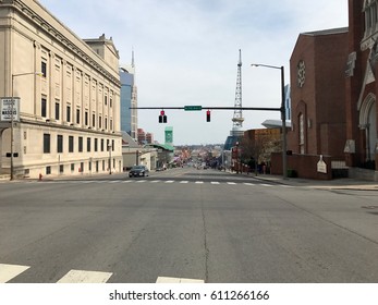 Nashville Tennessee - Circa 2017: Downtown Strip Country Music Row. Bars And Restaurants Line Street With Skyline Background.