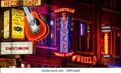 NASHVILLE, TENNESSEE - JULY 7th: Neon signs at night along Broadway Street in Nashville, Tennessee on July 7th, 2016.