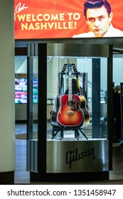 Nashville, Tennessee - March 22, 2019 : 'Welcome To Nashville' Sign Behind A Guitar Case At Nashville International Airport (BNA)