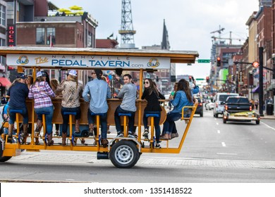 Nashville, Tennessee - March 25, 2019 : A Pedal Tavern Party Bike On A Beautiful Sunny Day Crossing Broadway. 