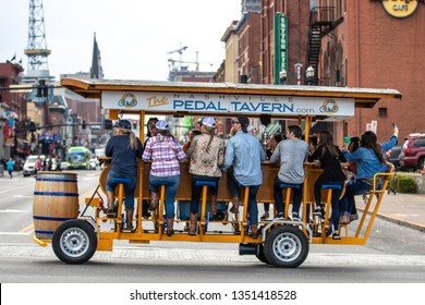 Nashville, Tennessee - March 25, 2019 : A Pedal Tavern Party Bike On A Beautiful Sunny Day Crossing Broadway. 