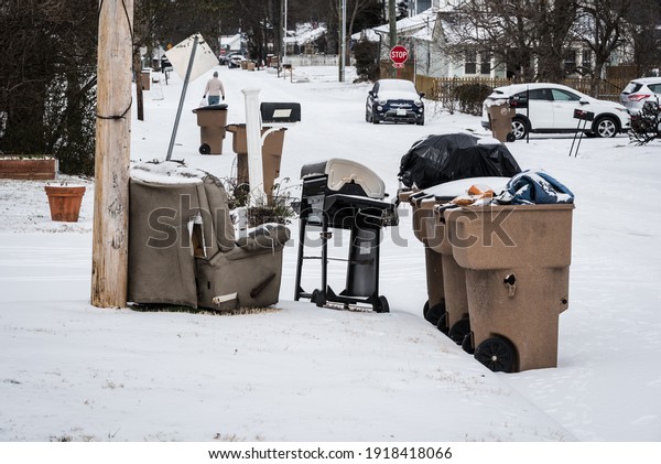 Nashville, Tennessee USA - February 16 2021: West\
Nashville Neighborhood Covered in thick ice and snow mix as city\
shuts down