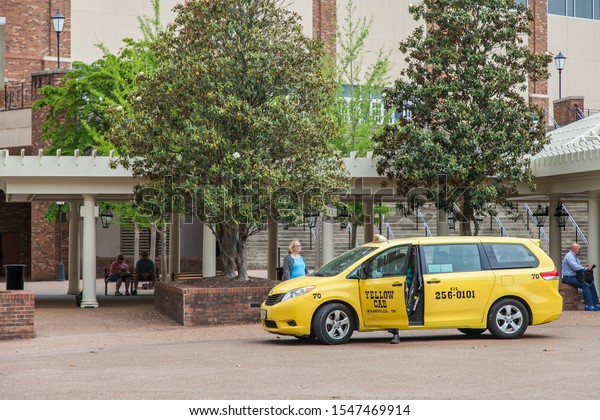 NASHVILLE\
,TENNESSEE ,USA - MAY 11 ,2015 : Yellow taxi provide airport\
transfer services in Nashville ,Tennessee\
USA.