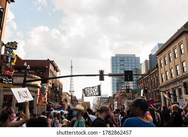 NASHVILLE, TN - JULY 24, 2020: Black Lives Matter Flag Waving During Protest March Down Music Row