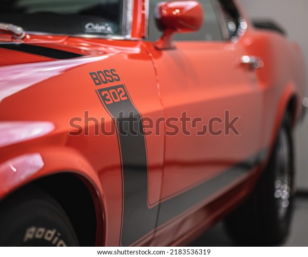 Nashville, TN - June 26 2019: 1970 Ford Mustang\
Boss 302. Classic American V8 Muscle Car in Calypso Coral Orange\
with Black interior