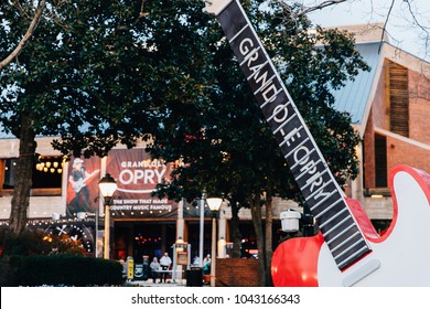 NASHVILLE, TN, USA - February 27, 2018: The Grand Ole Opry Is One Of The Most Famous Music Venues Since Being Created In 1925. The Area Around It Is Filled With Guitars, A Food Truck And Seating.